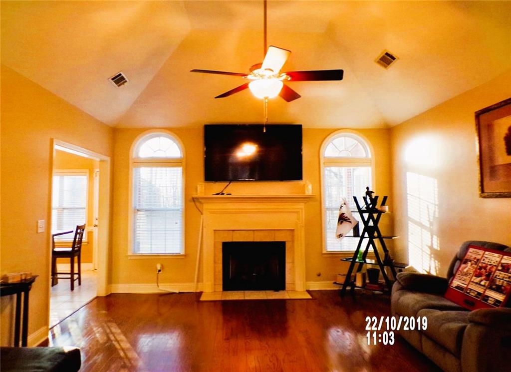 1035 Upchurch Road McDonough, GA 30252 - Photo 24 of 48 a living room with furniture and a fireplace