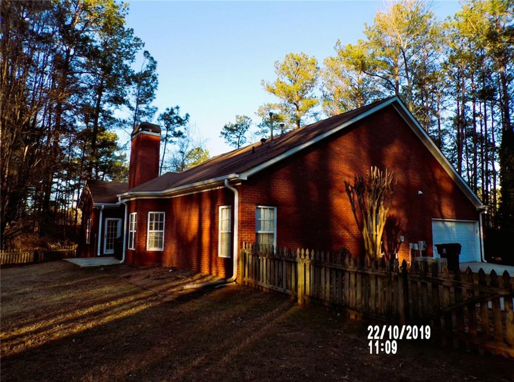 1035 Upchurch Road McDonough, GA 30252 - Photo 29 of 48 a view of a house with a yard