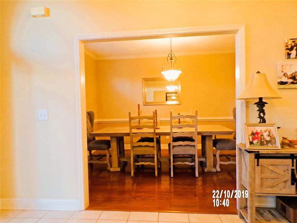 1035 Upchurch Road McDonough, GA 30252 - Photo 43 of 48 a dining room with lots of residential furniture and wooden floor