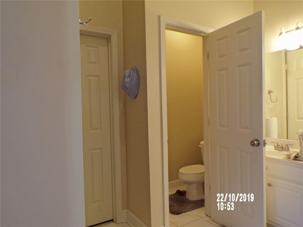 1035 Upchurch Road McDonough, GA 30252 - Photo 46 of 48 a bathroom with a shower toilet and a sink