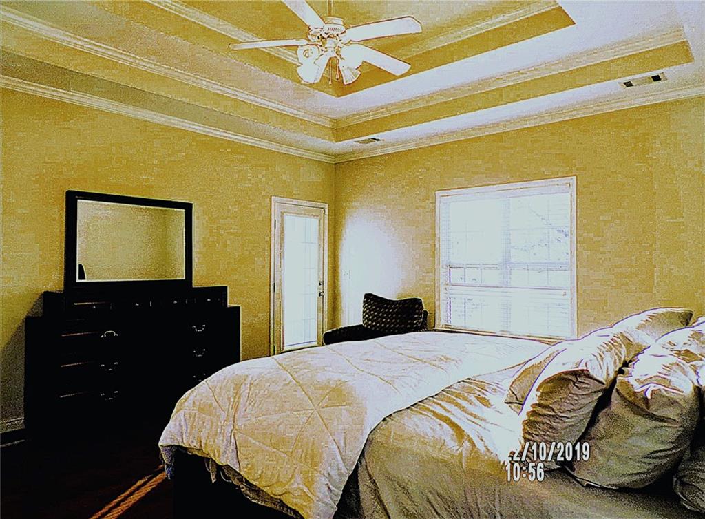 1035 Upchurch Road McDonough, GA 30252 - Photo 5 of 48 a bedroom with a bed and a dresser