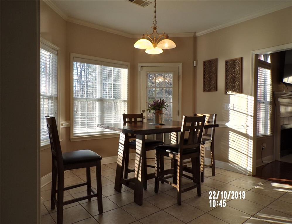 1035 Upchurch Road McDonough, GA 30252 - Photo 10 of 48 a view of a dining room with furniture and window