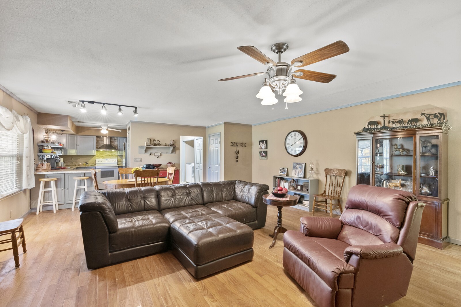 355 A Jernigan Road Portland, TN 37148 - Photo 22 of 47 a living room with furniture a clock and a large window