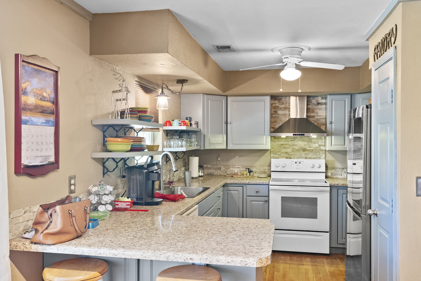 355 A Jernigan Road Portland, TN 37148 - Photo 23 of 47 a kitchen that has a lot of cabinets in it and wooden floor
