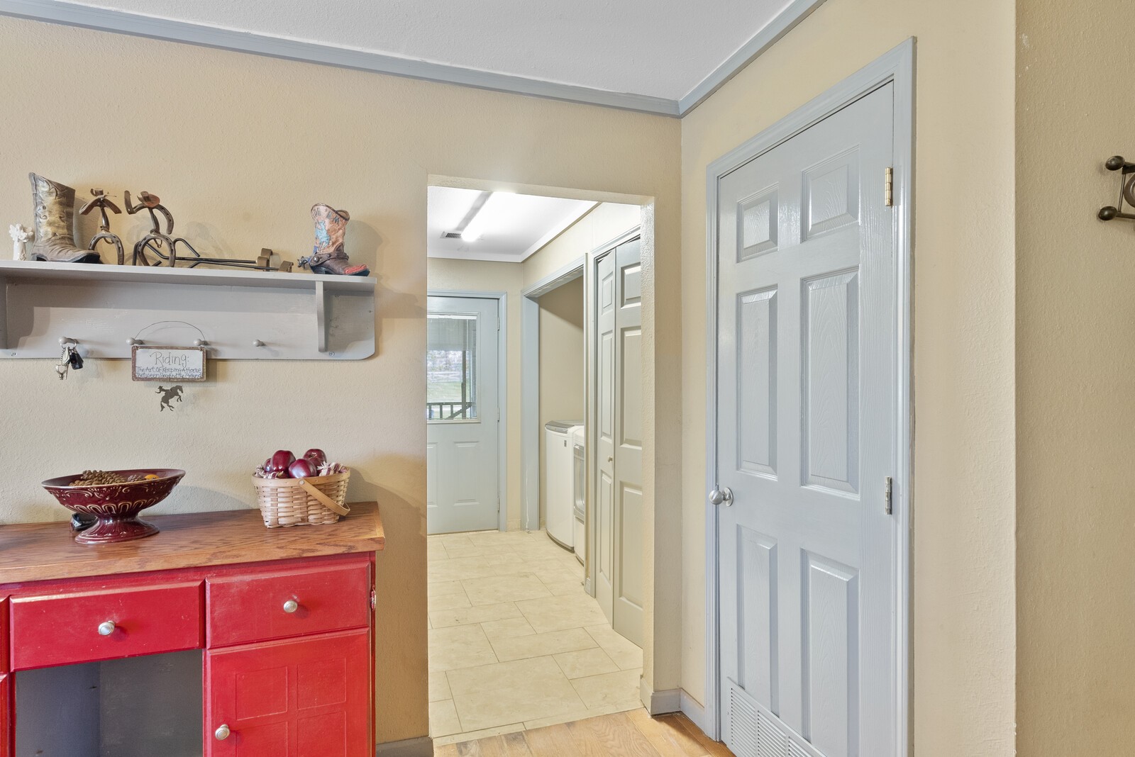 355 A Jernigan Road Portland, TN 37148 - Photo 7 of 47 a hallway with a dining table and cabinets