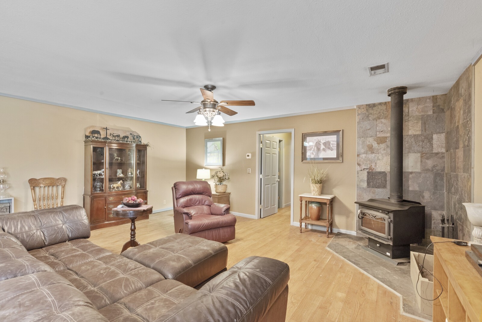 355 A Jernigan Road Portland, TN 37148 - Photo 10 of 47 a living room with furniture and a chandelier
