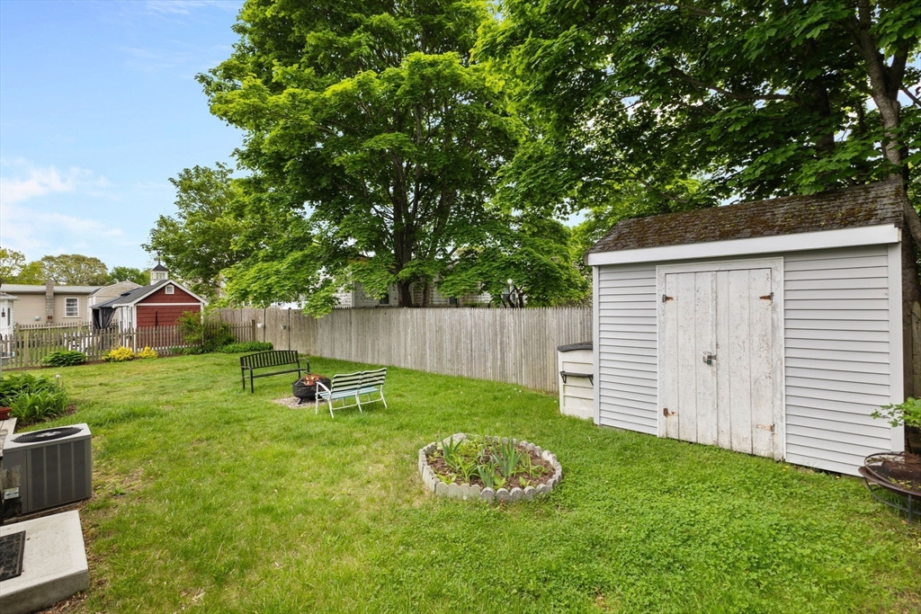 34 13th Street Wareham, MA 02558 - Photo 18 of 42 a view of a backyard with a garden and trees