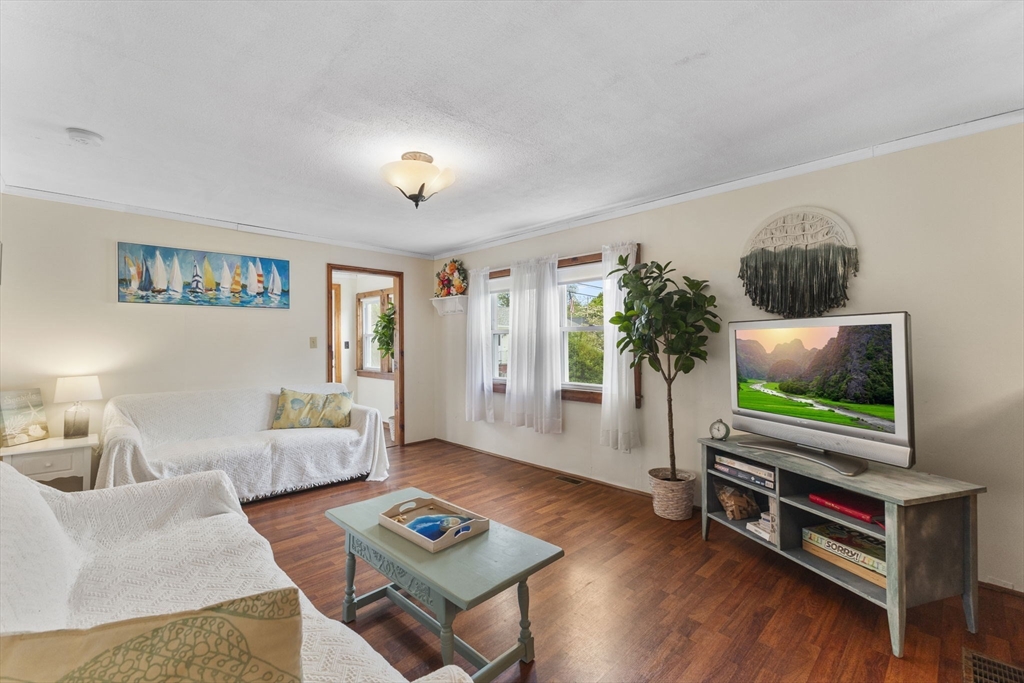 34 13th Street Wareham, MA 02558 - Photo 23 of 42 a living room with furniture and a flat screen tv