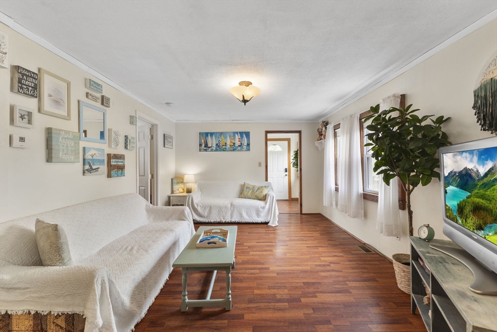 34 13th Street Wareham, MA 02558 - Photo 25 of 42 a living room with furniture and a wooden floor