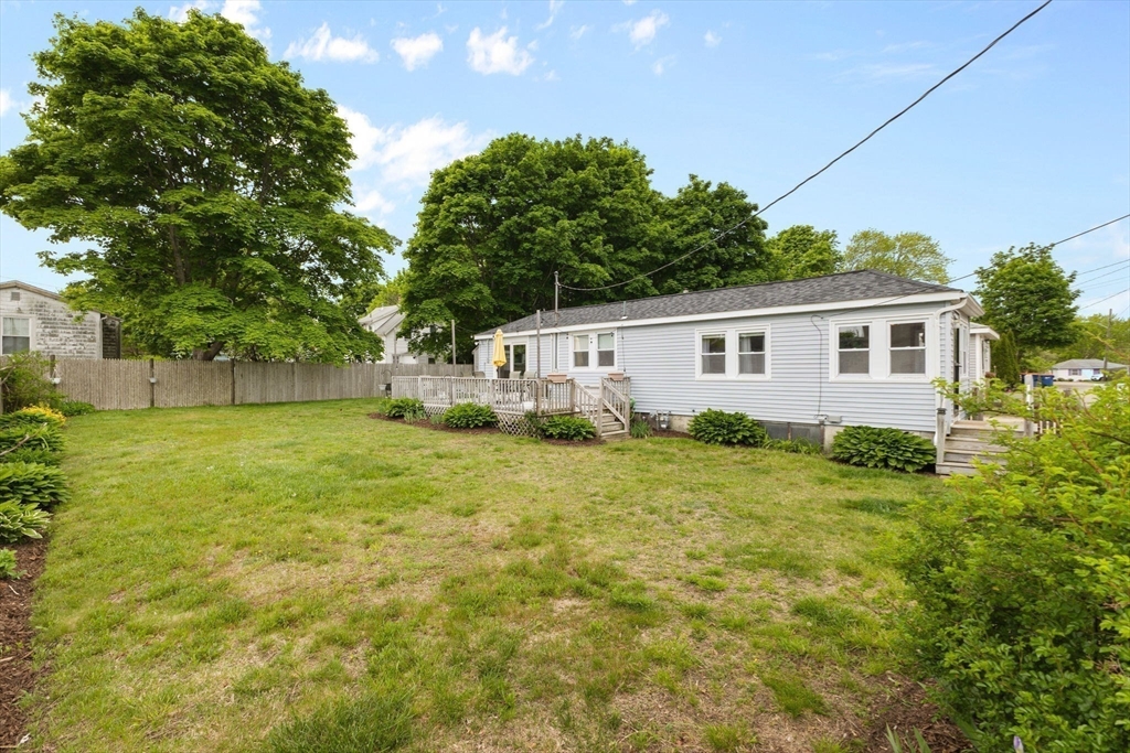 34 13th Street Wareham, MA 02558 - Photo 3 of 42 a view of a backyard with plants and a backyard
