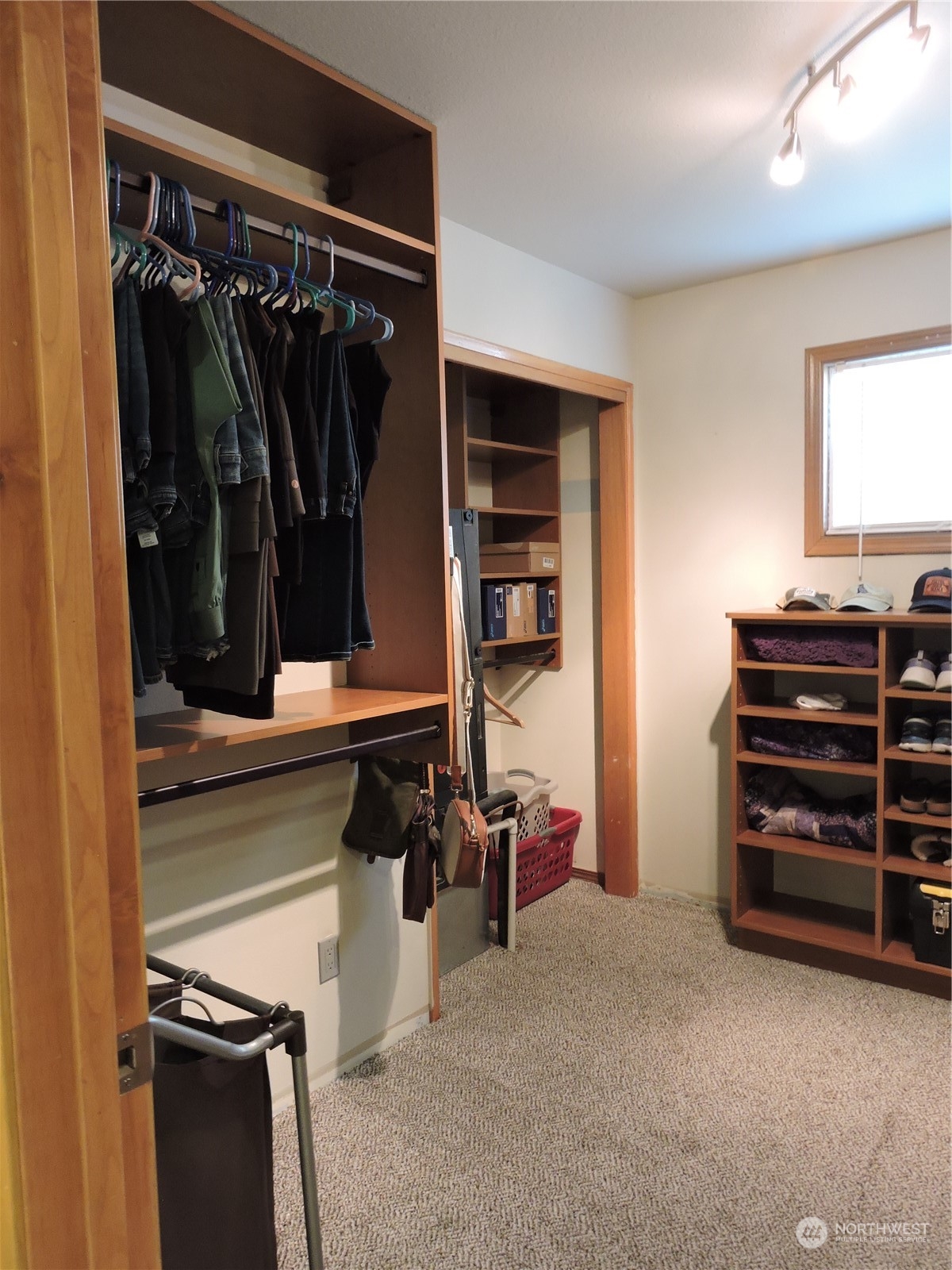 1402 Adams Road North Quincy, WA 98848 - Photo 16 of 39 a view of walk in closet with clothes and shoes