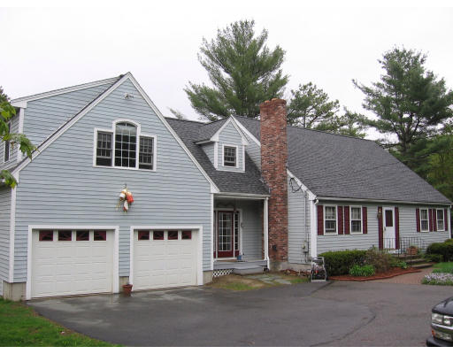 271 Hoyts Wharf Road Groton, MA 01450 - Photo 1 of 8 a front view of a house with a garden