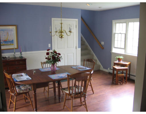 271 Hoyts Wharf Road Groton, MA 01450 - Photo 3 of 8 a view of a dining room with furniture and wooden floor