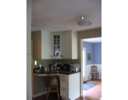 271 Hoyts Wharf Road Groton, MA 01450 - Photo 4 of 8 a kitchen with a sink and cabinets