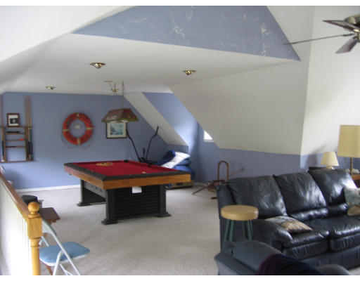 271 Hoyts Wharf Road Groton, MA 01450 - Photo 5 of 8 a living room with furniture and screen