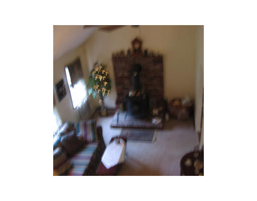 271 Hoyts Wharf Road Groton, MA 01450 - Photo 6 of 8 a picture of a living room with a chair