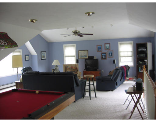 271 Hoyts Wharf Road Groton, MA 01450 - Photo 8 of 8 a living room with furniture rug and a window
