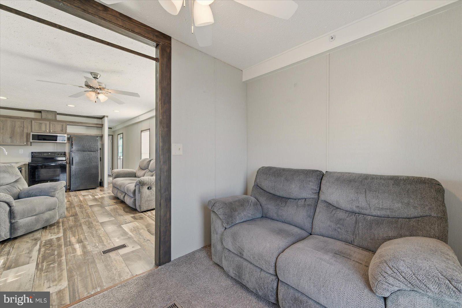 12346 Old Bridge Road, Unit 112 Ocean City, MD 21842 - Photo 23 of 72 a living room with furniture