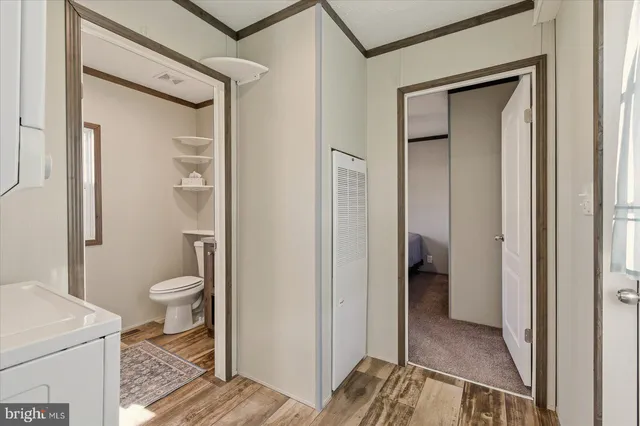 a view of hallway with washer and dryer