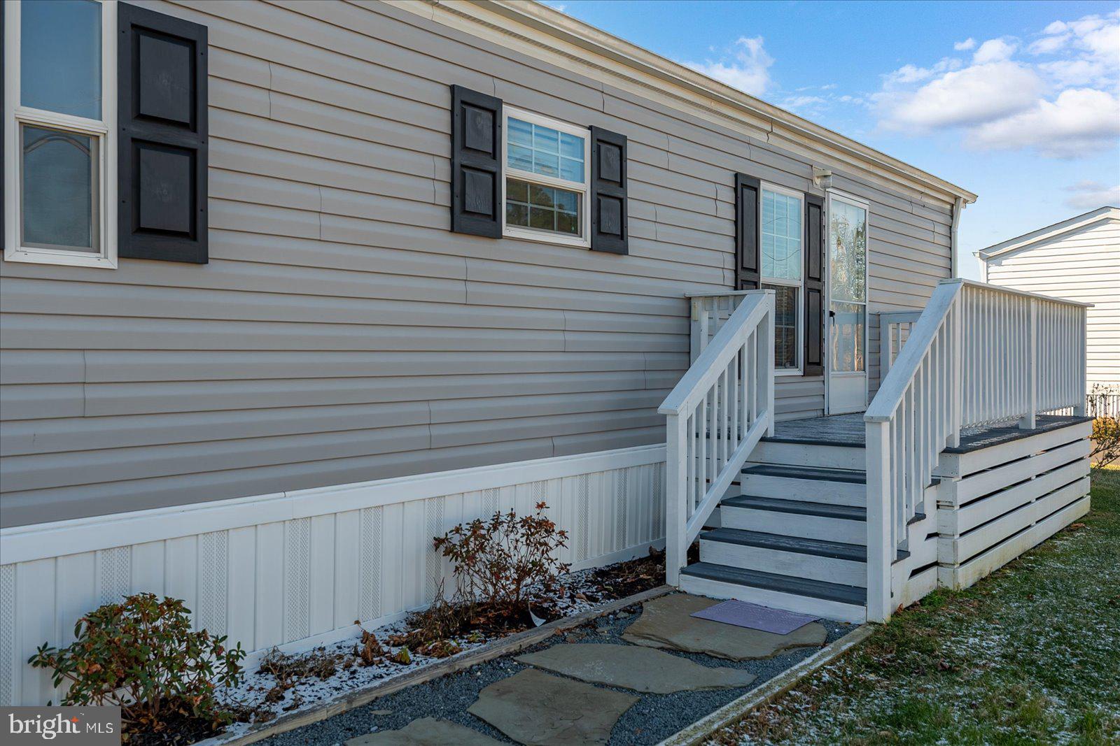 12346 Old Bridge Road, Unit 112 Ocean City, MD 21842 - Photo 3 of 72 a view of a house with a yard