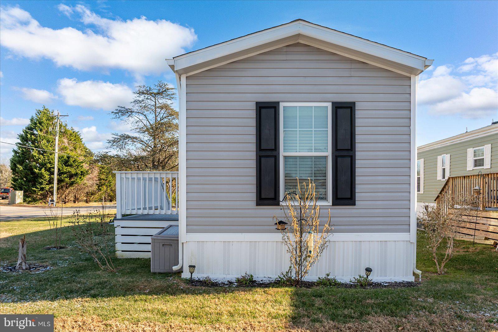 12346 Old Bridge Road, Unit 112 Ocean City, MD 21842 - Photo 37 of 72 a view of a house with backyard and garden