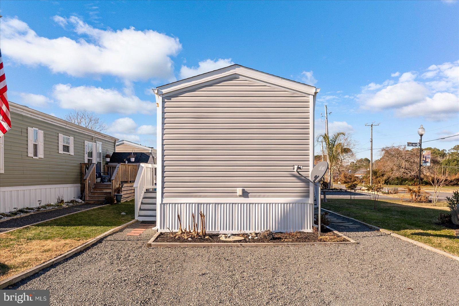 12346 Old Bridge Road, Unit 112 Ocean City, MD 21842 - Photo 38 of 72 a view of a house with backyard and porch