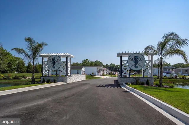 a view of swimming pool with outdoor seating and lake view