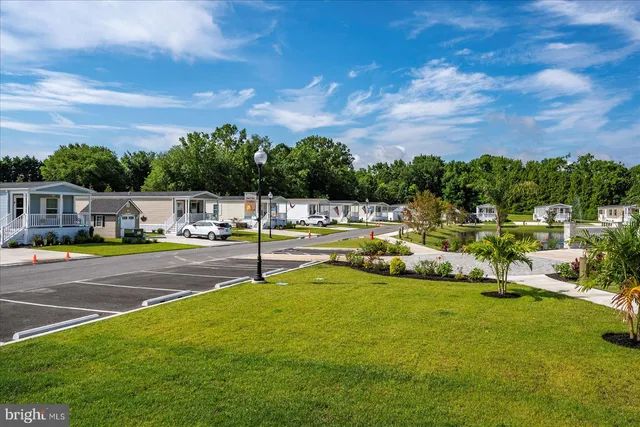 a view of multiple houses with yard