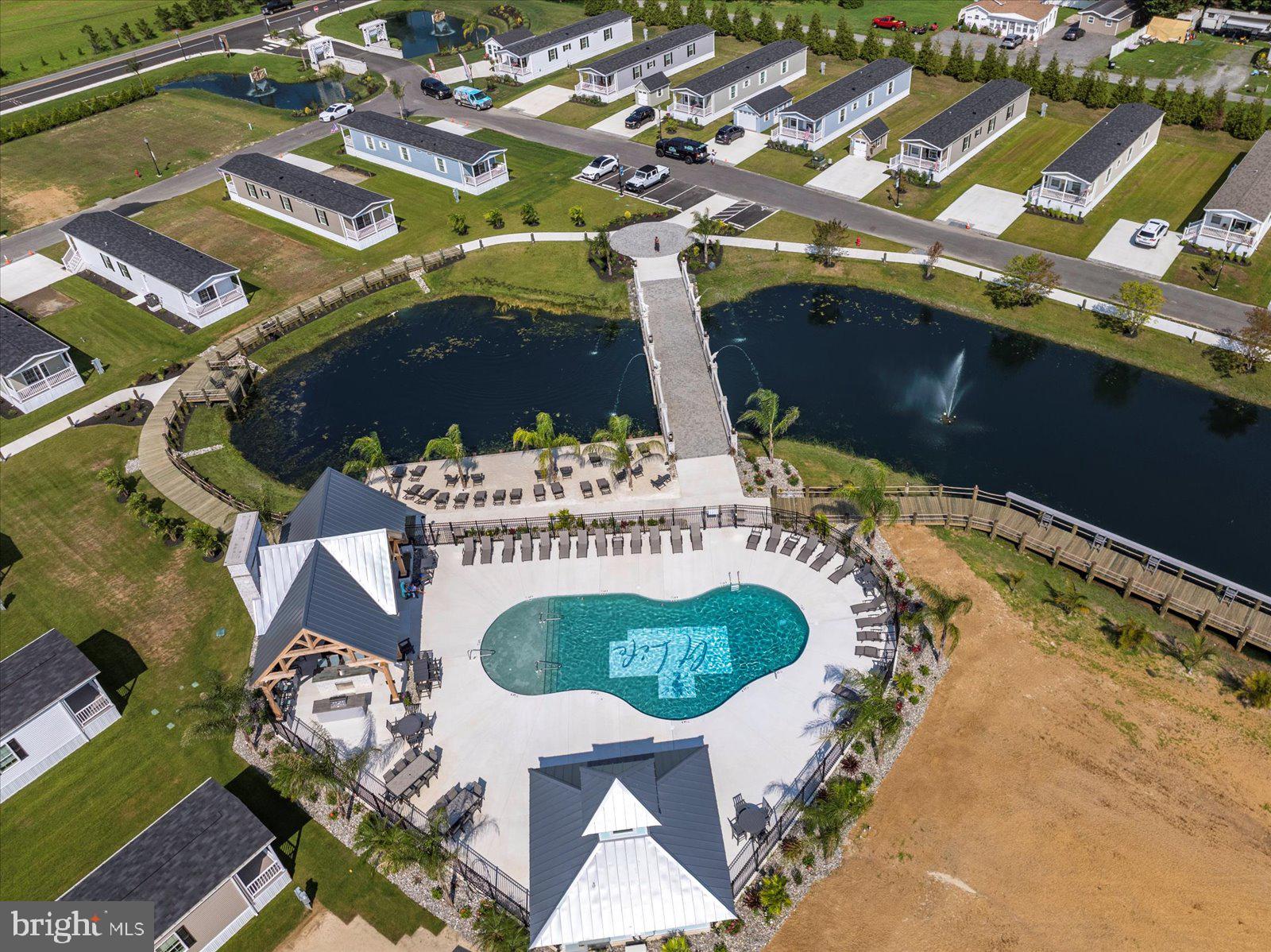 12346 Old Bridge Road, Unit 112 Ocean City, MD 21842 - Photo 67 of 72 an aerial view of residential houses with outdoor space
