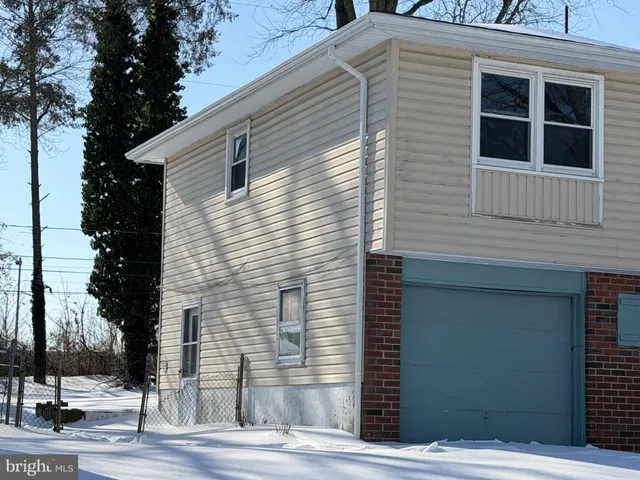 a view of a house with a street