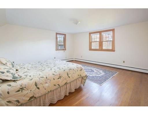 103 Page Road Lincoln, MA 01773 - Photo 11 of 12 a bedroom with a bed with wooden floor