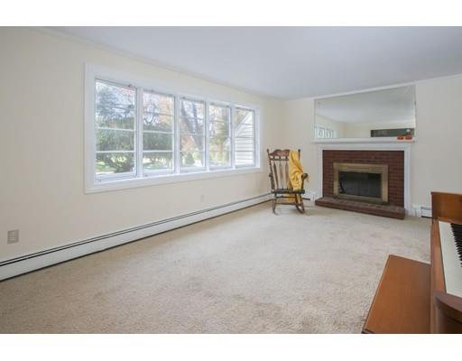 103 Page Road Lincoln, MA 01773 - Photo 3 of 12 a living room with furniture and a fireplace