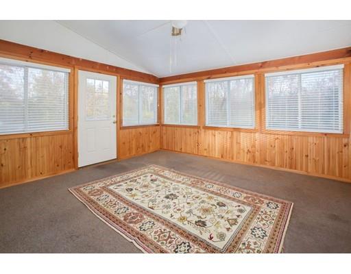 103 Page Road Lincoln, MA 01773 - Photo 5 of 12 a view of an empty room with a window