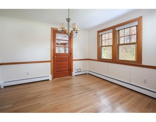 103 Page Road Lincoln, MA 01773 - Photo 8 of 12 a view of an empty room with a window and wooden floor