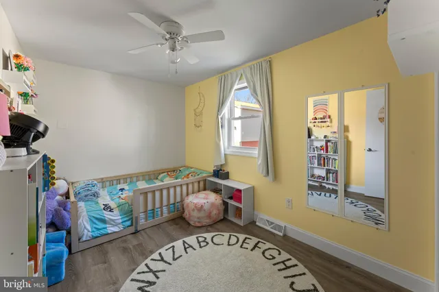 a bedroom with furniture and a window