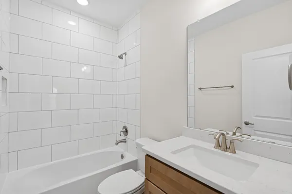 a bathroom with a sink toilet bathtub and shower