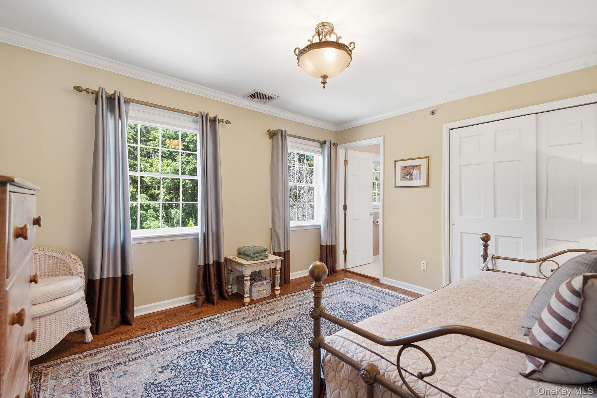 33 Hevelyne Road Elmsford, NY 10523 - Photo 24 of 43 Hardwood floors in 3rd bedroom with crown molding and a closet