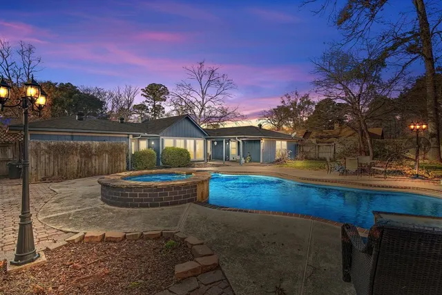 a view of house with outdoor space and sitting area