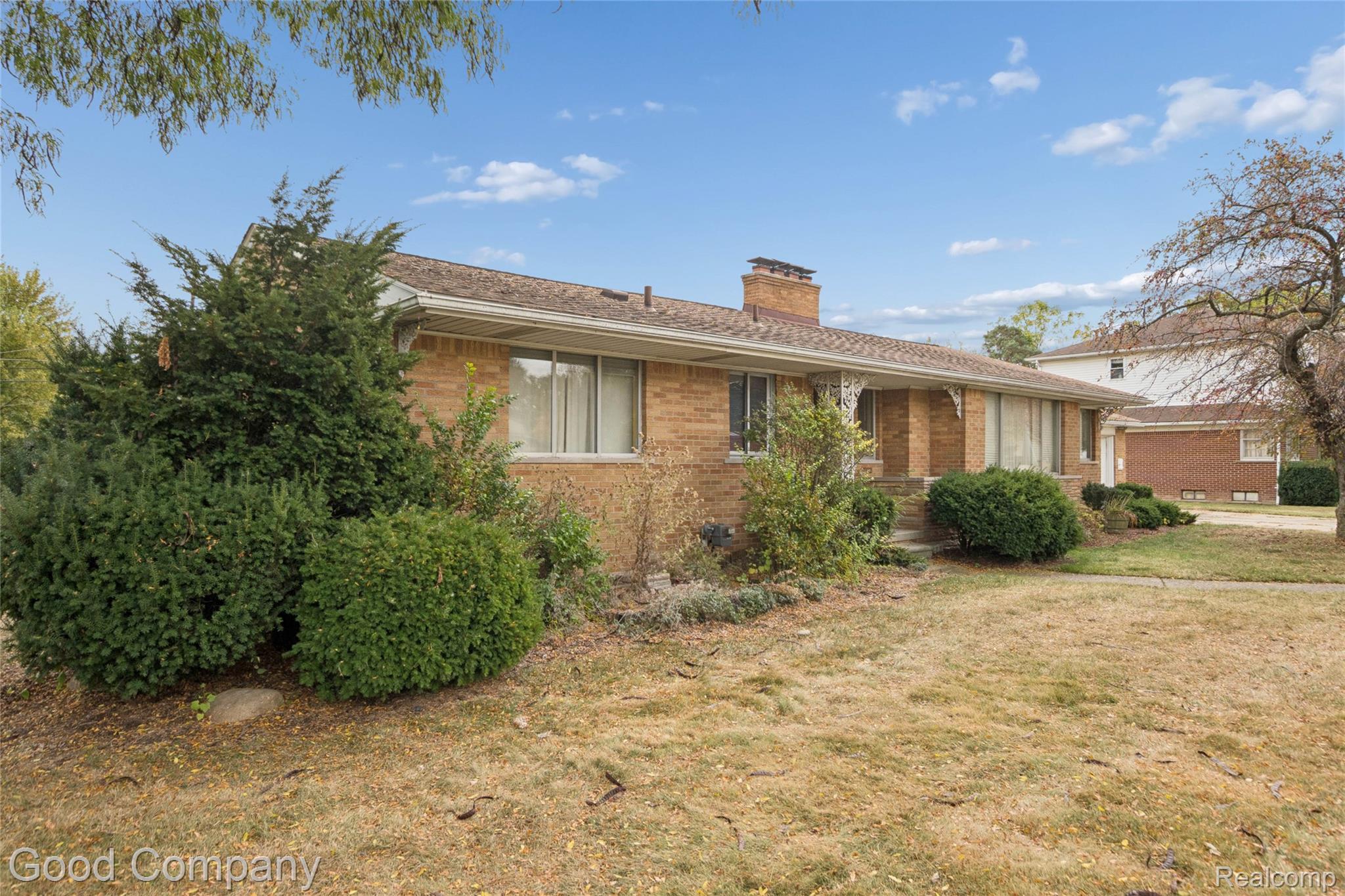 33920 Mulvey Road Fraser, MI 48026 - Photo 2 of 49 Ranch-style house with a chimney, brick siding, and a front yard