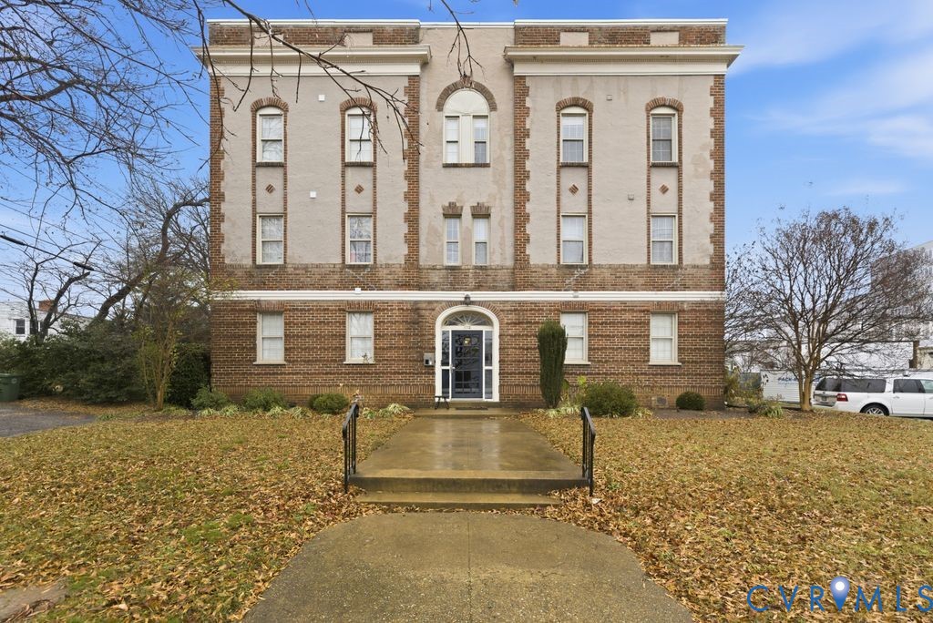 View of front of property with brick siding