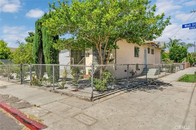 a dining room with furniture and a chandelier