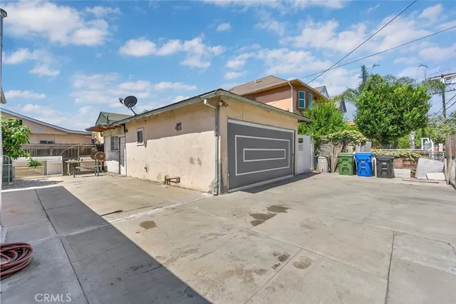 a wooden bench sitting in front of a building