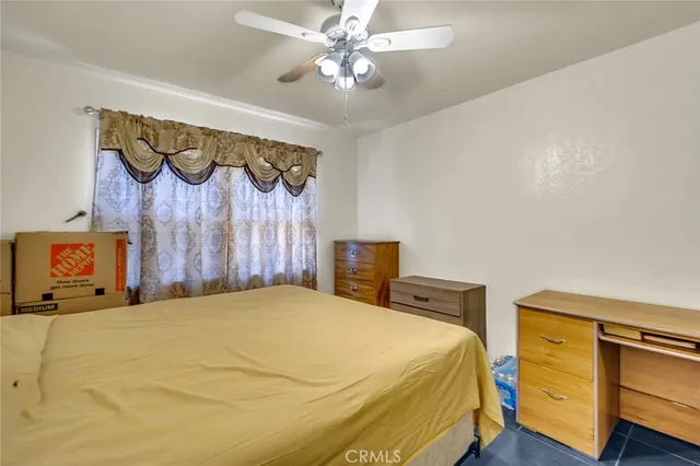a spacious bedroom with a bed and a walk in closet