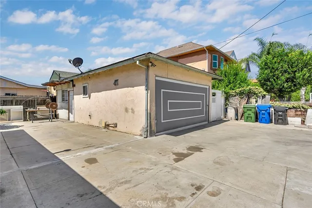 a kitchen with stainless steel appliances a sink stove and refrigerator