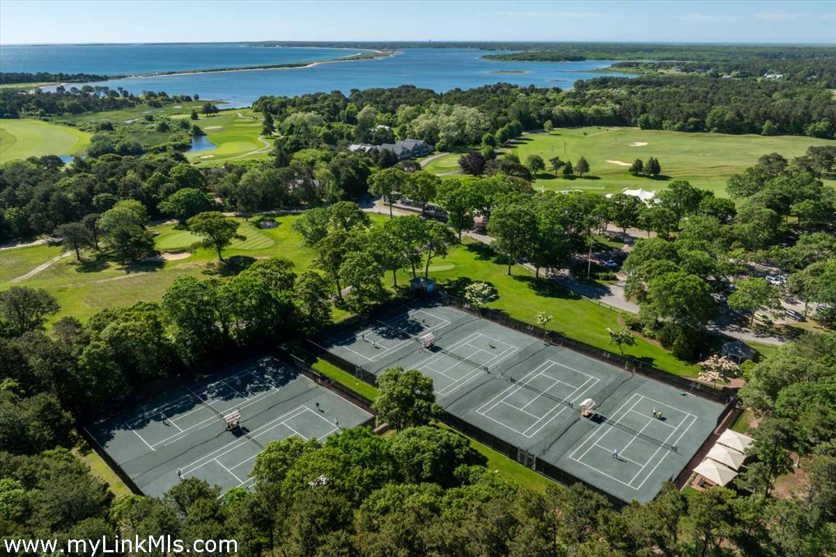 7 Overview Lane Oak Bluffs, MA 02557 - Photo 3 of 14 an aerial view of a house with a yard