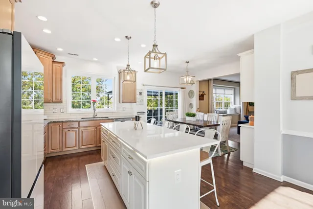 a kitchen with a sink stove and wooden cabinets