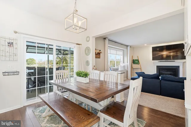 a view of a livingroom with furniture window and wooden floor