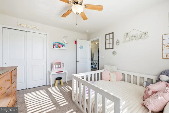 a bedroom with furniture and a chandelier