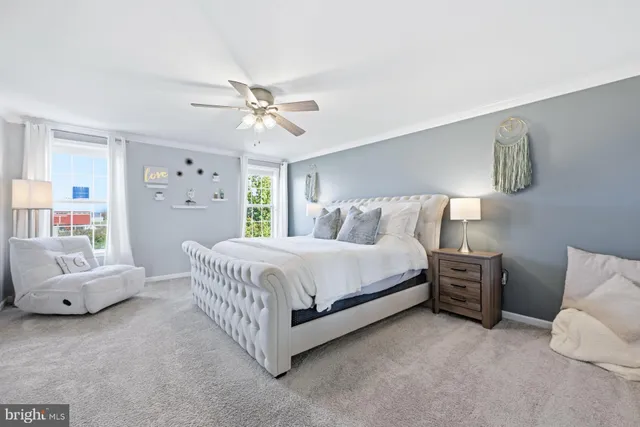 a spacious bedroom with a bed and a couch