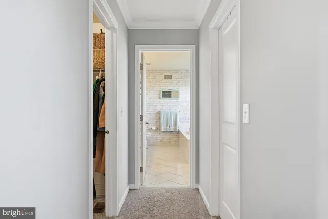 a view of a bathroom from a hallway